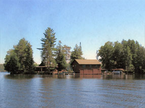 The Modern Era: image of Angler's Isle Northwoods Resort from Lake Mamie.